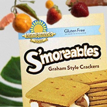 Kinnikinnick S’moreables Graham Style Crackers surrounded by fruits and leaves