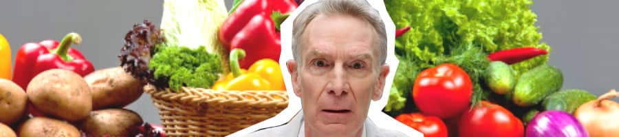 bill nye surrounded by vegetables