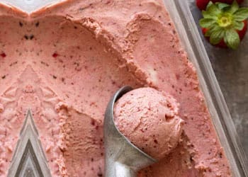 scooping strawberry ice cream