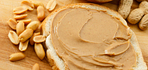 peanut butter on bread with nuts around it