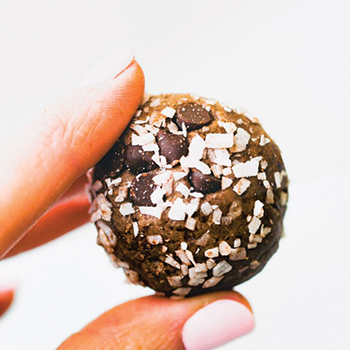 Holding The Chocolate Coconut Protein Ball