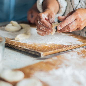 woman making dough with flour